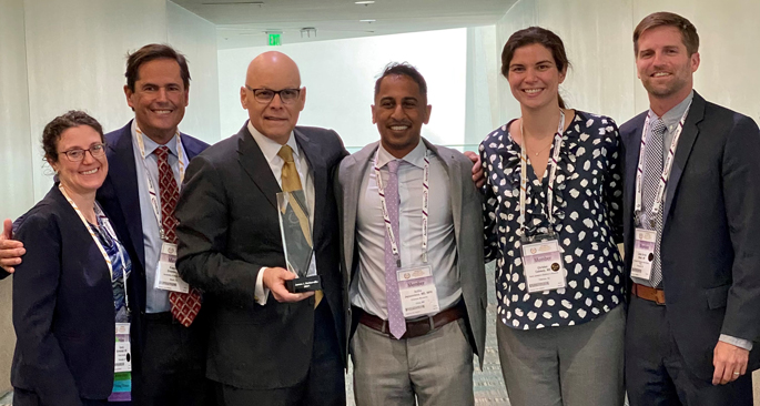 James Netterville, MD, third from left, poses with former residents and fellows, from left, Cecelia Schmalbach, MD, Frank Civantos, MD, Asitha Jayawardena, MD, Christen Caloway, MD, and C. Burton Wood, MD.