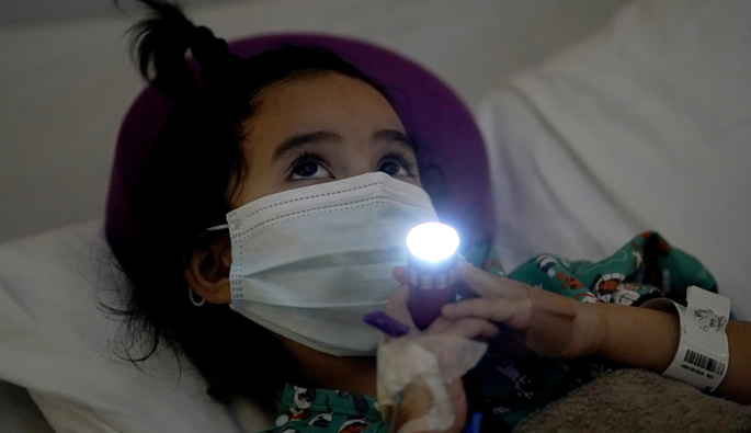 Bella Villamil, 5, turns on her flashlight for the third annual Night Lights at Monroe Carell Jr. Children’s Hospital at Vanderbilt.