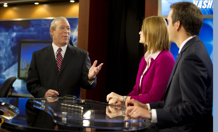 Veteran meteorologist Davis Nolan, left, rehearses a newscast with weekend anchor Erin Holt and meteorologist Justin Bruce at WKRN Channel 2. (photo by Joe Howell)