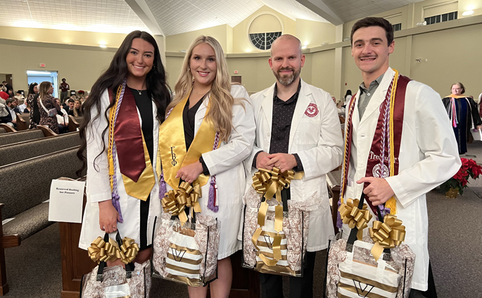The first graduates of the Nurse Scholars Program (including the area where they are starting) are, from left, Taylor Sams, RN (Medical Intensive Care Unit), Bailey Wheeler, RN (Adult Emergency Department), Josh Thomas, RN, (Pediatric Cardiology), and Corbin Lackey, RN (Pediatric Emergency Department).