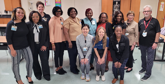 Members of the Nurse Diversity Equity and Inclusion Committee volunteered at the Health Sciences Academy at Pearl-Cohn High School in North Nashville, including (front row, from left) Sim Birdsong, Lynae Carlson, Constance Dotye, (back row, from left) Brittany Ewin, Brenda Reed, Rachel Kromer, L. Rochelle Symlar, Mamie Williams, Marsha Sesay, LaSheryl Brown, Amber White, Marilyn Dubree, and James Hawley.