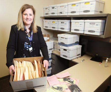 Karen Anne Pittman with some of the unclaimed property that patients have left behind at VUMC’s hospitals and clinics.