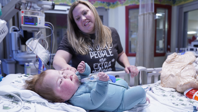 Lacey Ray plays with her son, Carter, at Monroe Carell Jr. Children’s Hospital at Vanderbilt. Carter, who has a rare esophageal condition, has spent his entire life in hospitals.