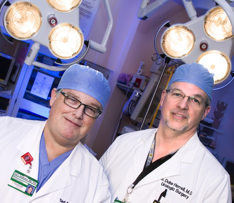 Ted Anderson, M.D., Ph.D., left, and Duke Herrell, M.D., are among the surgeons using the robotic system. (photo by Susan Urmy)