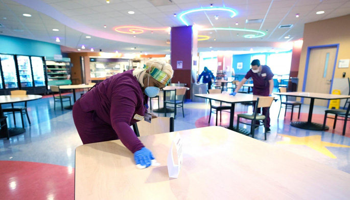 As part of International Housekeepers & Environmental Services Week, VUMC honored workers like Lakeshia Fletcher, shown here wiping down tables in the Café at Monroe Carell Jr. Children’s Hospital at Vanderbilt, who have been on the front lines during the pandemic to keep facilities clean and safe.