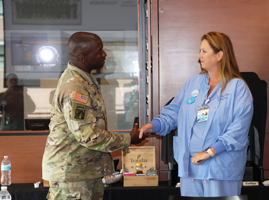 Wendy Paszek, RN, CNOR, a preceptor for the SMART program, meeting Lieutenant General R. Scott Dingle, the U.S. Army Surgeon General and Commanding General of the U.S. Army Medical Command, during his visit to observe the program in 2022. (Photo by Donn Jones)