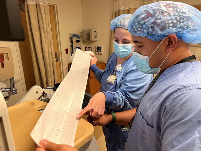 Sgt. Josiah Cubol, an LPN in the U.S. Army, works with VUMC Labor and Delivery RN preceptor Chelsea Foster, RN, during his SMART Labor and Delivery rotation in April.