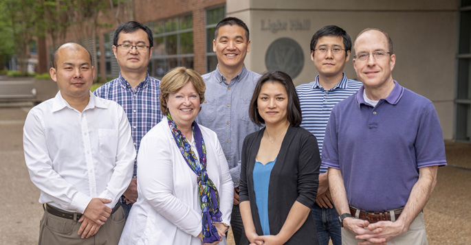 Researchers who helped find high-risk genes for schizophrenia included, from left, Quan Wang, PhD, Bingshan Li, PhD, Nancy Cox, PhD, Rui Chen, PhD, Xue Zhong, PhD, Qiang Wei, PhD, and James Sutcliffe, PhD.