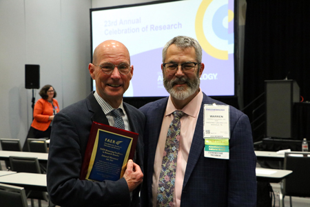 Ed Sherwood, MD, PhD, left, and Warren Sandberg, MD, PhD, pose for a photo after Sherwood received the 2023 Foundation for Anesthesia Education and Research Mentoring Excellence in Research Award.
