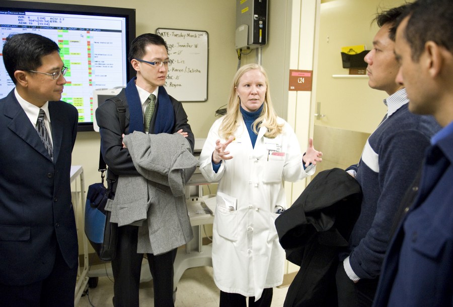 Amy Schindler, M.D., talks with representatives from Singapore who are studying Vanderbilt’s graduate medical education programs. (photo by Joe Howell)