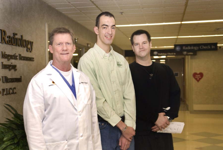 Vanderbilt Law student Ted Spangler, center, with members of the team that treated him following his stroke; J.J. (Buddy) Connors, M.D., left, and Paul Clemmons, R.N. (photo by Susan Urmy)