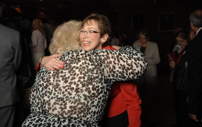Dubree, right, gets a hug from JoAnn Emerich following Monday's State of Nursing address. (photo by Susan Urmy)