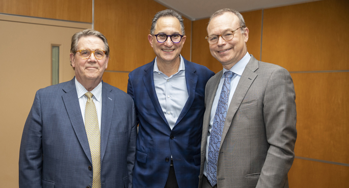 Paul Sternberg Jr., MD, center, with C. Wright Pinson, MBA, MD, left, and Jeff Balser, MD, PhD, at a recent celebration honoring Sternberg’s years of service to VUMC.