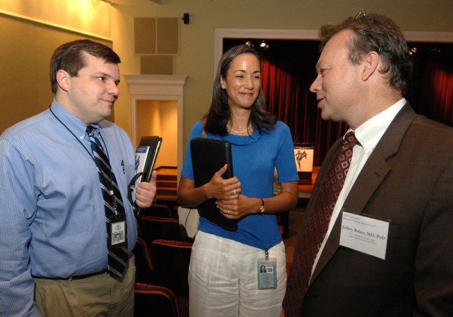 At Tuesday's event, Jeff Balser, M.D., Ph.D., right, talks with Michael Warren, M.D., medical director of the Governor's Office of Children's Care Coordination, and Veronica Gunn, M.D., chief medical officer of the Tennessee Department of Health. (photo by Anne Rayner)
