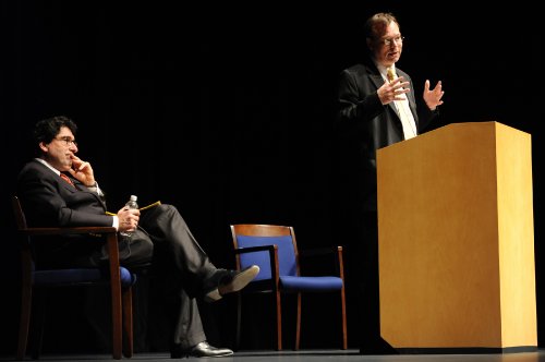Jeff Balser, M.D., Ph.D., right, and Chancellor Nicholas S. Zeppos talk with staff and faculty at Wednesday’s town hall meeting. (photo by Joe Howell)