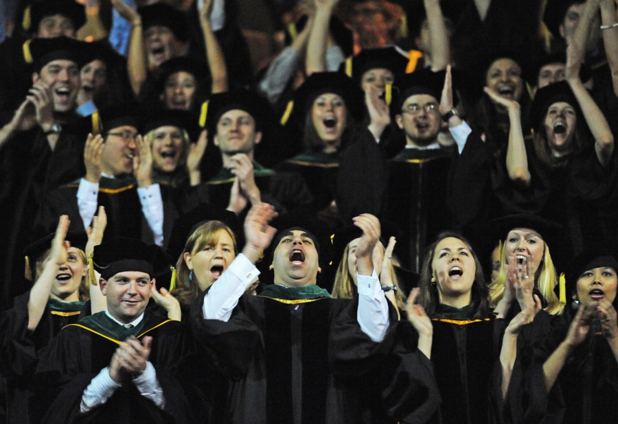 The School of Medicine class of 2011 cheers during commencement last Friday at Memorial Gym. (photo by Joe Howell)