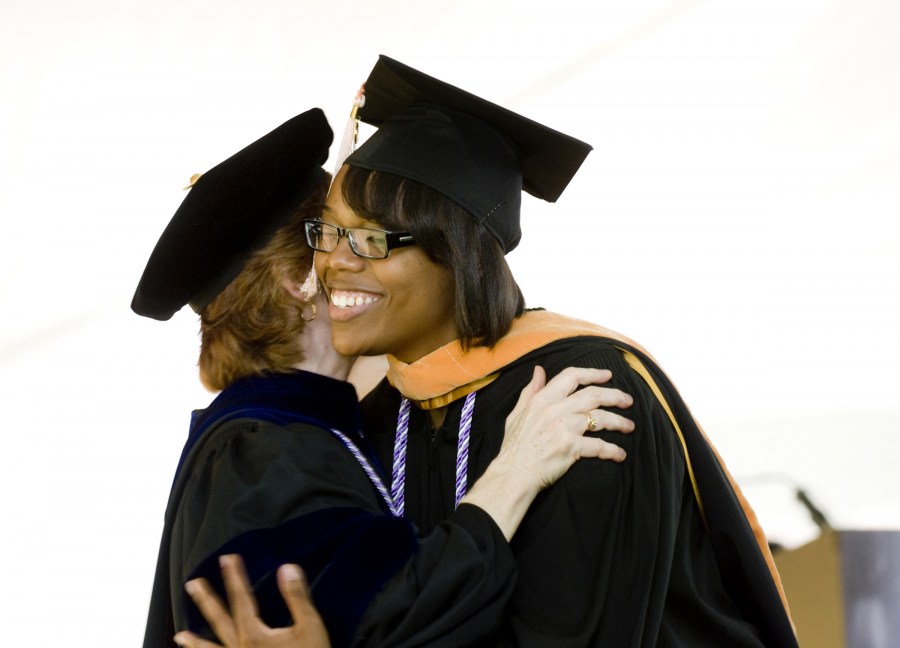 VUSN’s Kyla Stripling gets a hug from Joan King, Ph.D., M.S.N., after receiving her academic hood. (photo by Susan Urmy)
