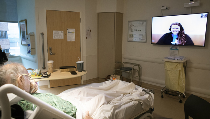 VUMC’s new virtual nurse program allows Katy Byers, RN, to talk with patient Jimmy Sawyers remotely. (photo by Susan Urmy)