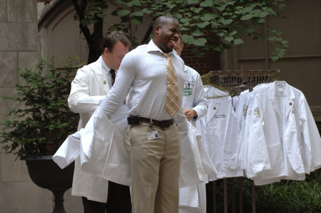 It was a bit of a struggle at first, but Kevin Carr finally got his white coat on. (photo by Anne Rayner)