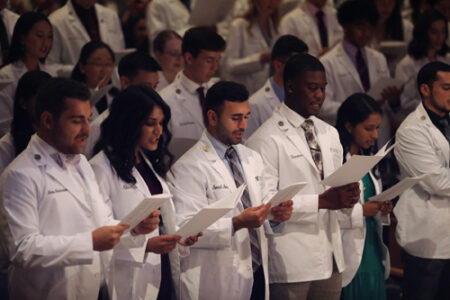 White coat recipients recite the Oath for Teachers and Learners of Medicine at Vanderbilt.