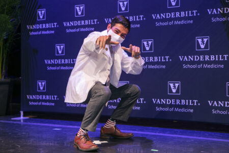Steven Bishay strikes a pose after receiving his white coat.