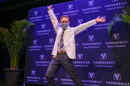 Even with a mask on, it was easy to tell Andrew Kittleson was all smiles after receiving his white coat.
