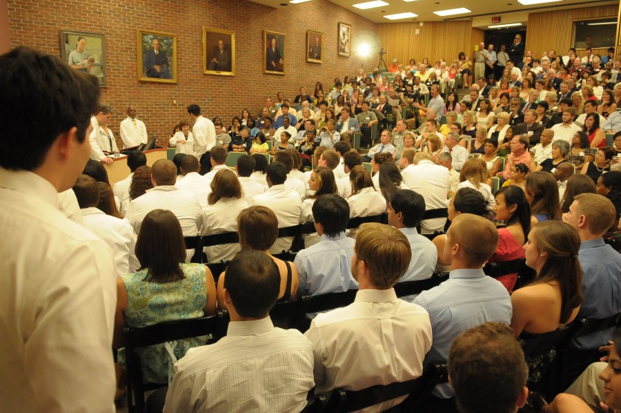 Light Hall was packed for the White Coat Ceremony, which moved indoors this year due to the heat. (photo by Mary Donaldson)