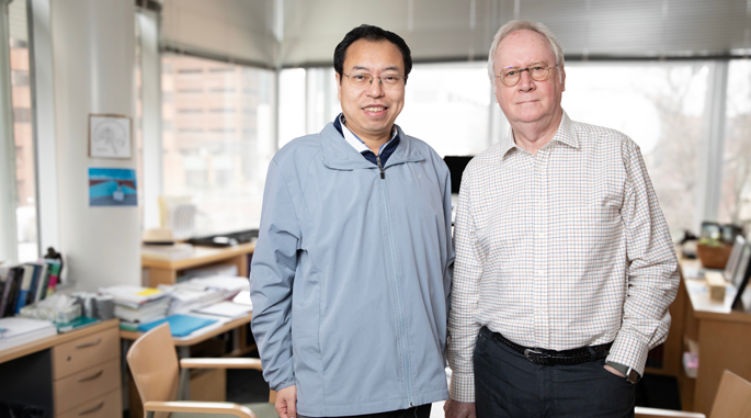 Zhongliang Zu, PhD, left, and John Gore, PhD, are leading an effort to map brain networks in three dimensions. (photo by Erin O. Smith)