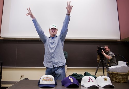 Jim Phillips brought out hats to signify his top choices. Phillips matched at the University of Alabama Medical Center. (photo by Joe Howell)
