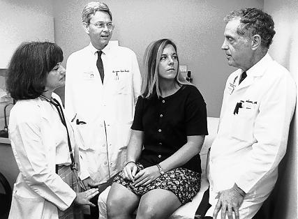 A growing number of patients with congenital heart disease are living into adulthood.  Here Dr. Thomas Graham Jr. (right), Yvonne Bernard, R.N., and Dr. Ben Byrd III talk with patient Mary Roskilly