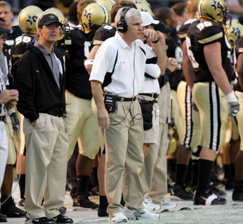 Kurt Spindler, left, medical director of Vanderbilt Sports Medicine, serves as the head team physician for Vanderbilt Athletics. He is on the sidelines for every Commodores football game, along with coach Bobby Johnson.
photo by Dana Johnson