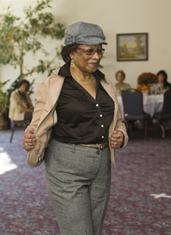 Pat Turner strikes a pose during the Employee Celebration Month fashion show, held at the University Club. (photo by Dana Johnson)
