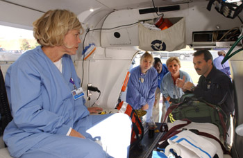 Connie Hutson, Gateway labor and delivery nurse, and other L&D nurses look on as LifeFlight nurse Mark Tankersley describes how patients are cared for in route to the hospital.