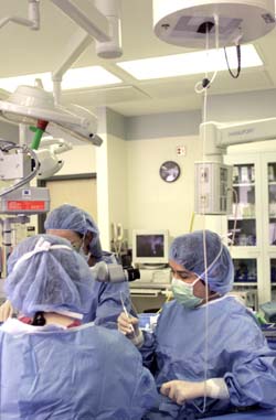 Dr. Karen Joos was assisted by Dr. Louise Mawn, left, and surgery tech Sharon Horn in the surgery, which was performed at the W.M. Keck Foundation Free-Electron Laser Center at Vanderbilt Sept. 29. (photo by Dana Johnson)