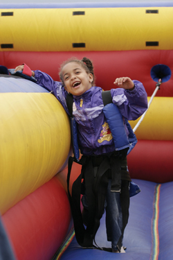 Erikka Eubanks, 5, tried out the inflatable velcro challenge bouncy booth.
photo by Kats Barry