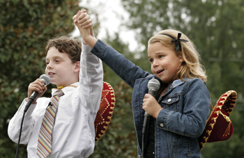 Matthew Minor, 8, and Lauren Haynes, 6, sang “Together Wherever We Go” on the Children’s Performance Stage at We Care for Kids Day.
photo by Kats Barry