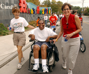 Linda Pilkinton, the wife of a red cap survivor, Carolyn Word, and Gail Thompson, R.N., all faithful Dayani Center members, move toward the finish line.