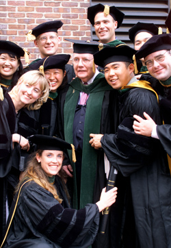 VUSM’s class of 2000 gave Dean John Chapman a group hug following the school’s graduation ceremony at Langford Auditorium.
by Dana Johnson
