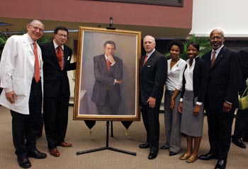 On hand for the unveiling of the portrait honoring Levi Watkins Jr., M.D., were, from left, VUSM Dean Steven Gabbe, M.D., Watkins, Harry Jacobson, M.D., vice chancellor for Health Affairs, VUSM students Rasheeda Stephens and Monica Giles, and George Hill, Ph.D., associate dean for Diversity in Medical Education. photo by Anne Rayner