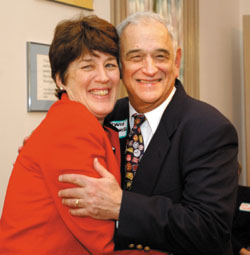 Barbara Clinton, director for Center for Health Services, hugs Dr. Lewis B. Lefkowitz Jr. at a reception announcing an internship in community health named in his honor. (photo by Dana Johnson)