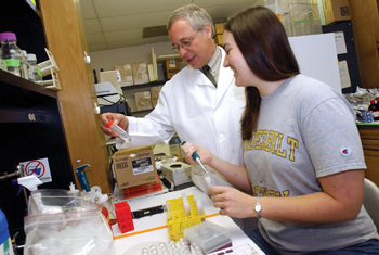 Alan Cherrington, Ph.D., professor and chair of Molecular Physiology & Biophysics, with graduate student Katie Stettler in his lab. 
photo by Dana Johnson