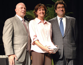 At last week’s Service Awards, Pamela Martin, who works at the <a href='http://www.vanderbilthealth.com/cancer'>Vanderbilt-Ingram Cancer Center</a>, was awarded this year’s Medical Center Commodore Award by Harry Jacobson, M.D., left, and interim chancellor Nick Zeppos. (photo by Dana Johnson)