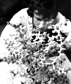 DuBois examines a model molecular structure during his early days as a researcher.
