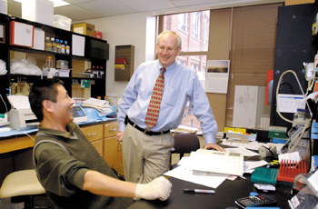 Dr. Ray DuBois talks with Ding-Zhi Wang, Ph.D., research associate professor of Medicine, in his lab. (photo by Dana Johnson)