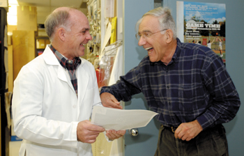 Corbin and Dr. John Exton share a laugh in his lab. (photo by Dana Johnson)