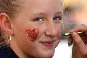 Candice Duncan, 11, gets her face painted with hearts.
Photo by Dana Johnson