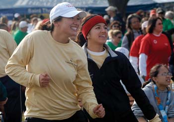 Kim Amsilli, right, an employee at the Dayani Center, and her sister, Lea, get ready to stroll.
Photo by Dana Johnson