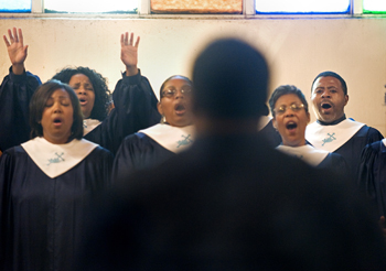 Easley, right, sings with the choir at St. Luke CME Church. Both Easley and his wife, Jannie, are active in the church. (photo by Joe Howell)