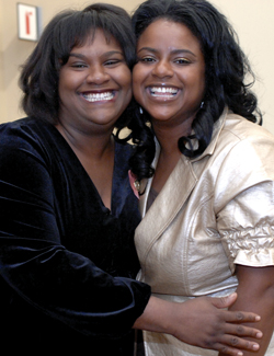Anitra Ellerby-Brown, left, received her pin from her sister, Charlotte Ellerby, who also received her M.S.N. from the School of Nursing. (photo by Dana Johnson)