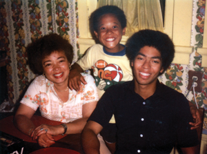 In his high school years, Harris, right, with his mother, Marie, and his brother, Charles.